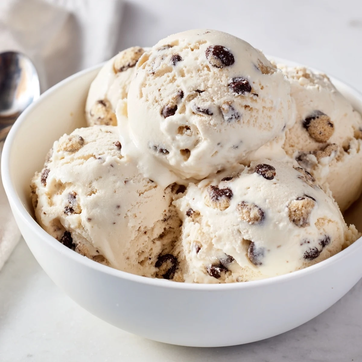 Creamy cottage cheese ice cream with chunks of cookie dough, a delicious summer treat.  