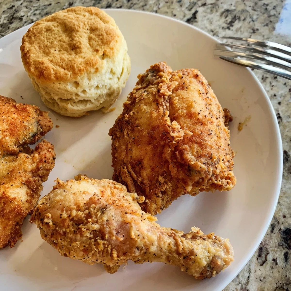 Crispy Southern fried chicken served with fluffy buttermilk biscuits for comfort.  
