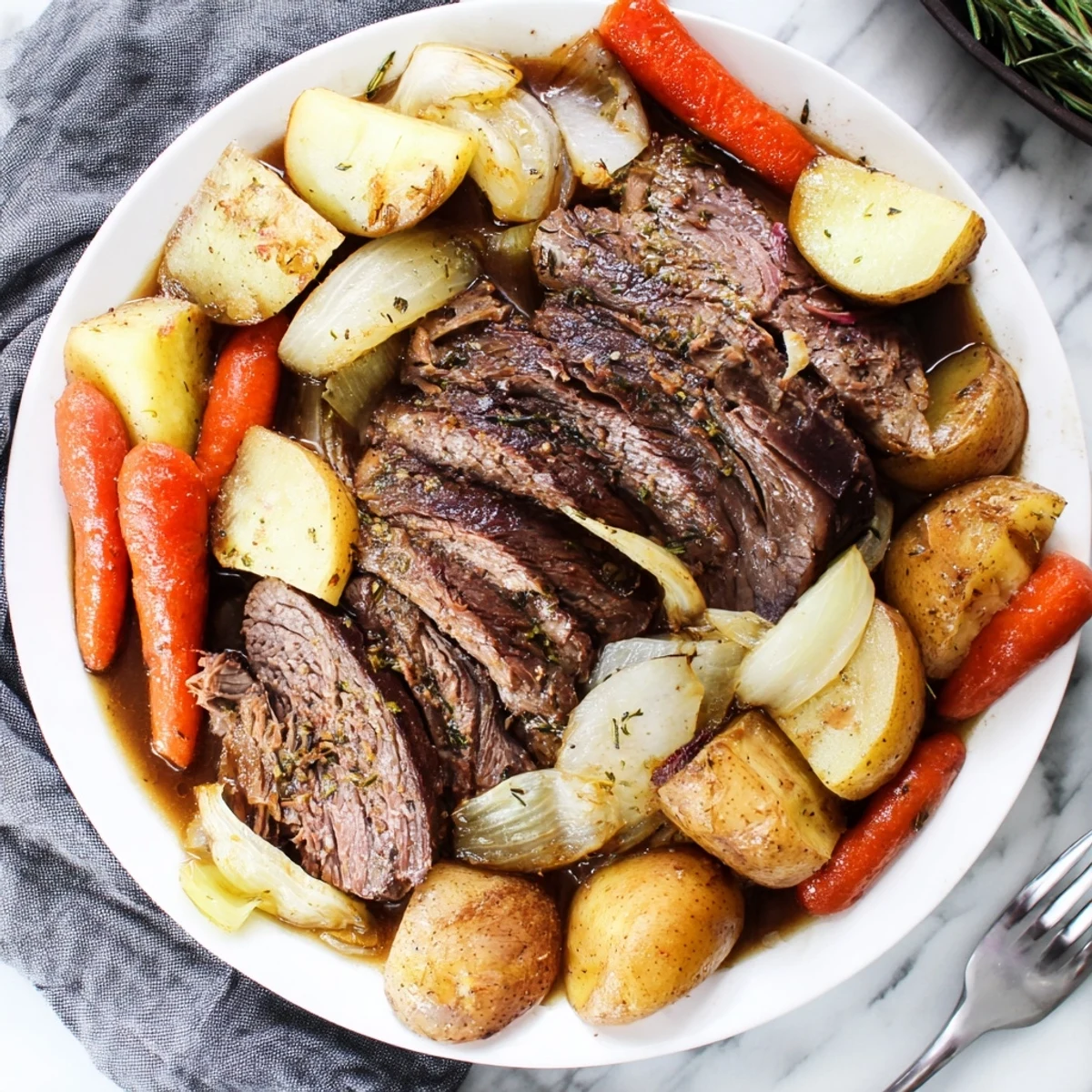 Savory Sunday pot roast slowly cooked with carrots and potatoes, bursting with flavor.