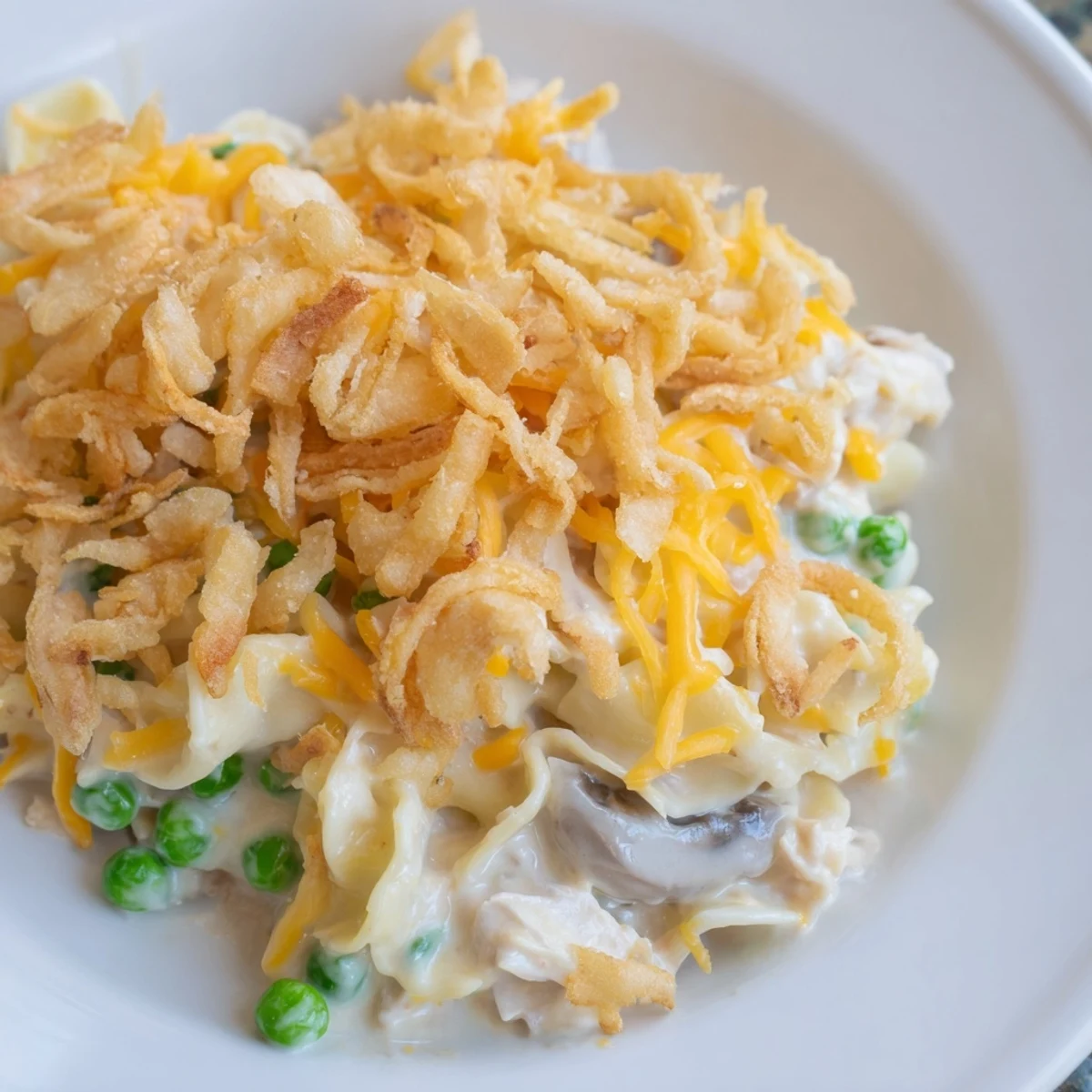 Golden, bubbly homemade Tuna Noodle Casserole with a crispy onion topping ready to serve.