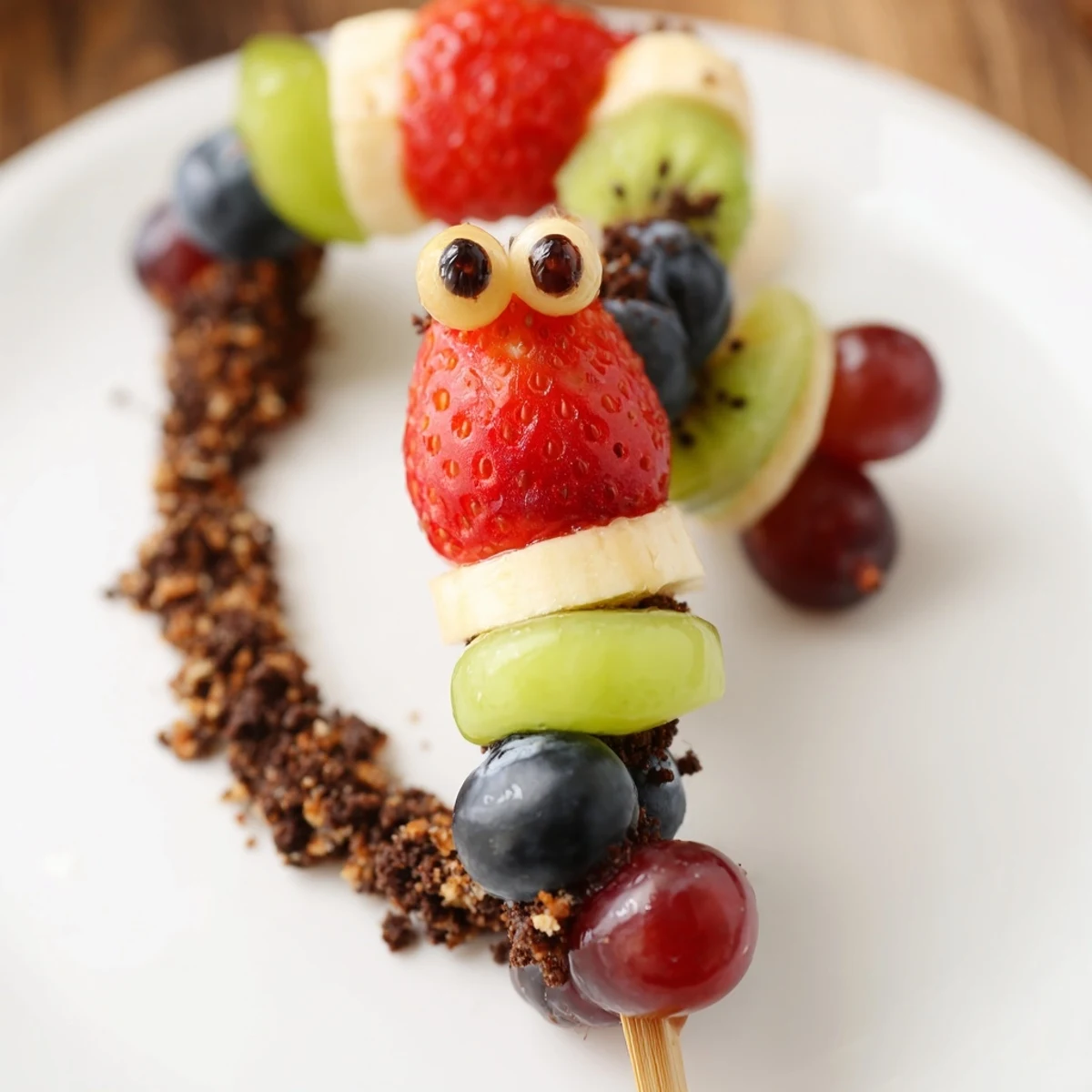 Kid-friendly Caterpillar Fruit Skewer Track with a delightful arrangement of fresh fruit for a playful treat.