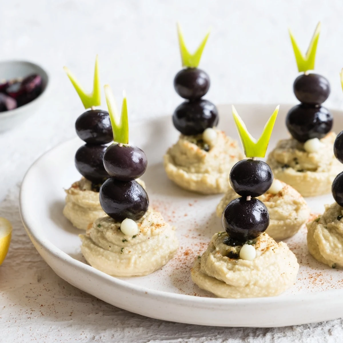 Creamy Winter Dip with adorable olive penguin garnishes, perfect for a festive appetizer.
