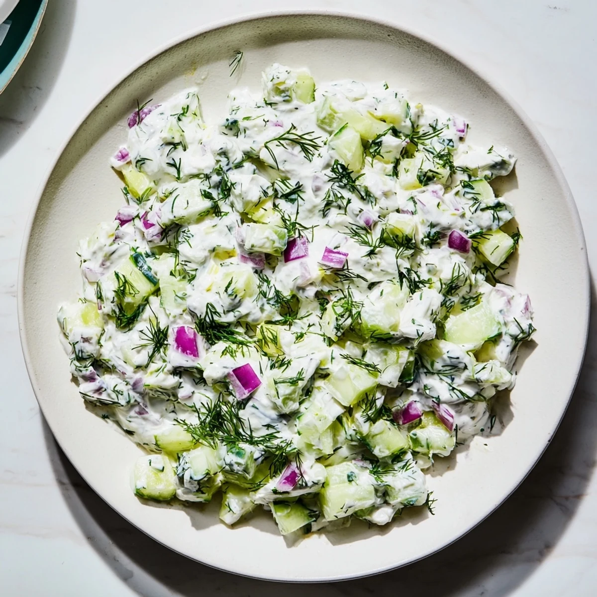 This quick cucumber and Greek yogurt tzatziki salad, a vibrant Greek inspired dish, perfectly balances creamy and crisp textures.