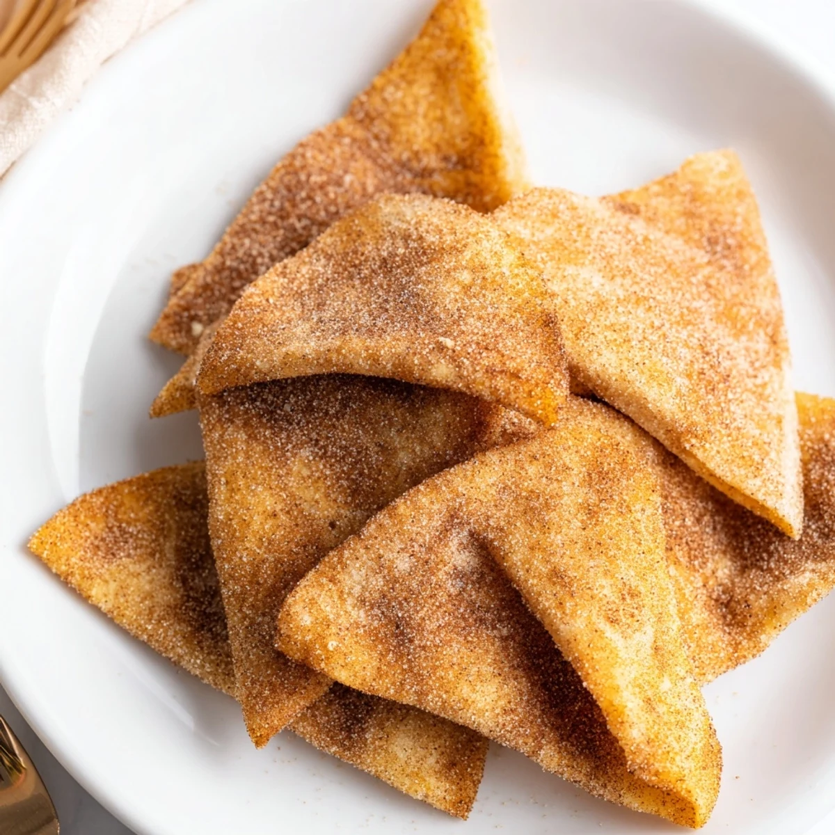 Golden, crispy cinnamon sugar tortilla chips, a tempting dessert snack ready to enjoy.