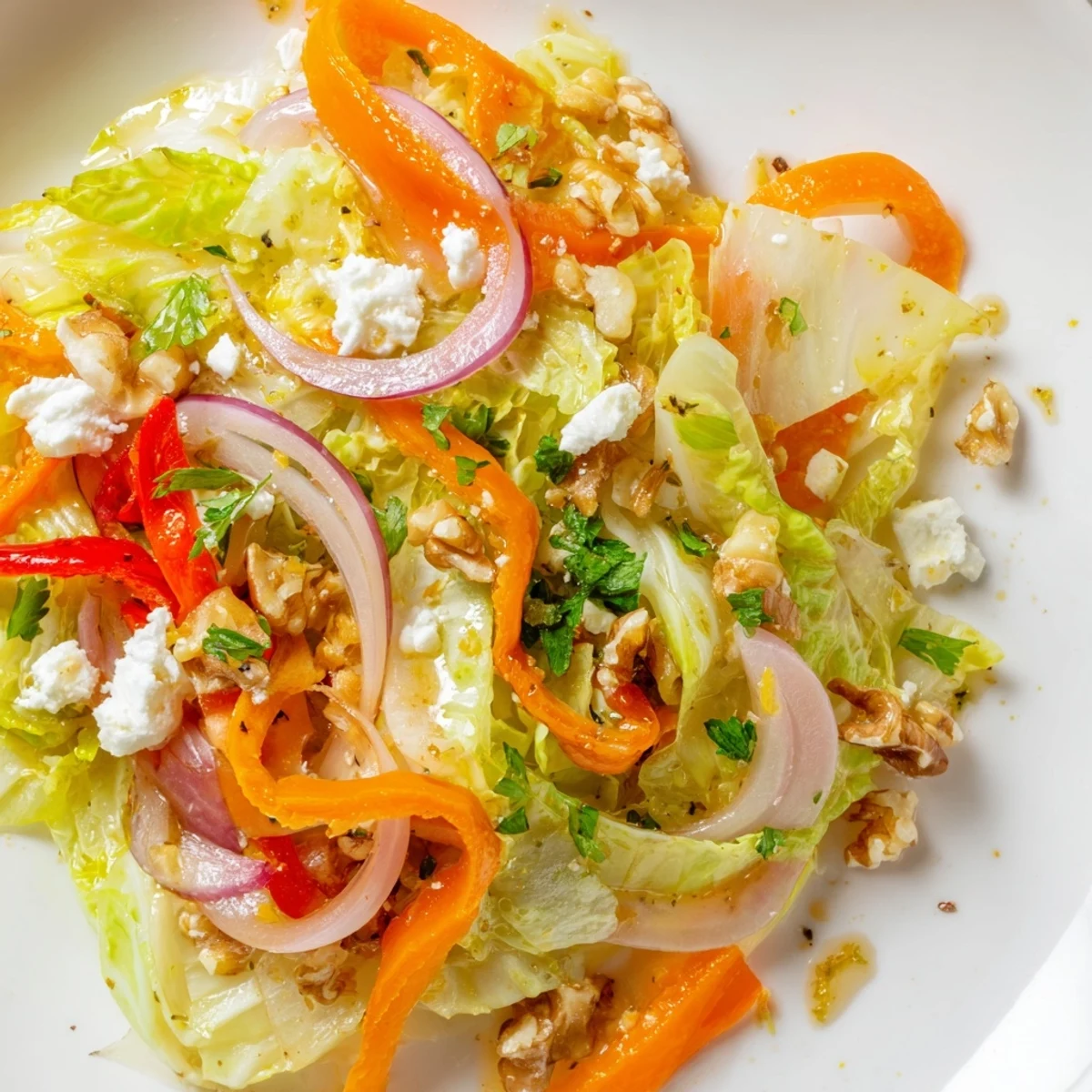 Fresh and vibrant Cooked and Loved Cabbage Salad with tender cabbage, red onion, and herbs, served warm as a vegetarian side.