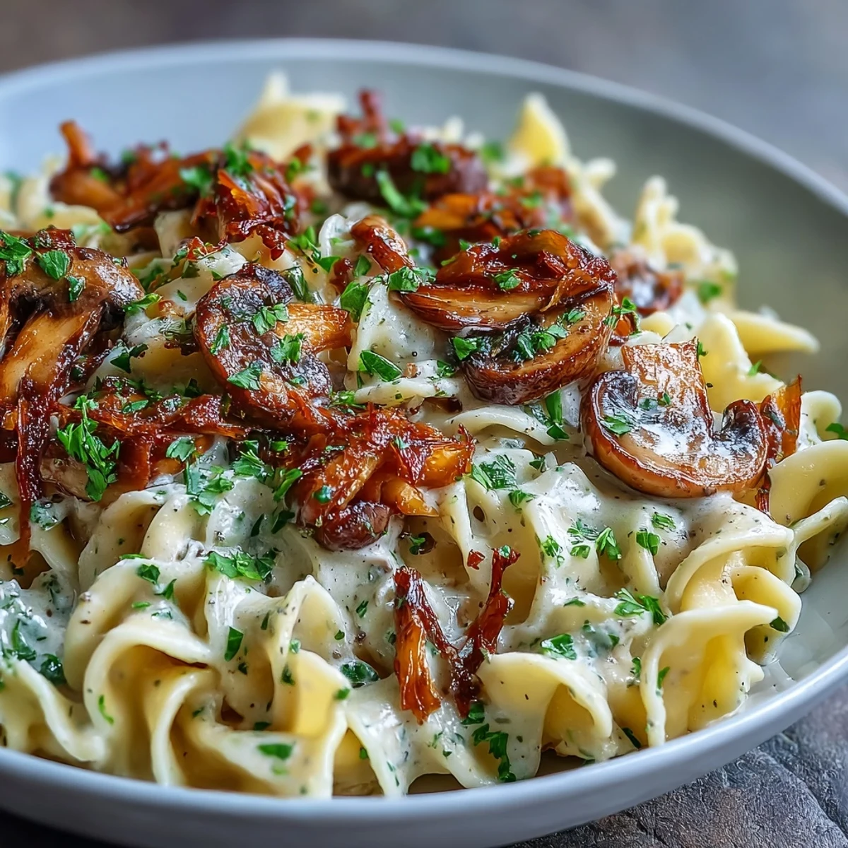 Creamy Mushroom Stroganoff served on a white plate, garnished with fresh parsley, paired with a glass of white wine.