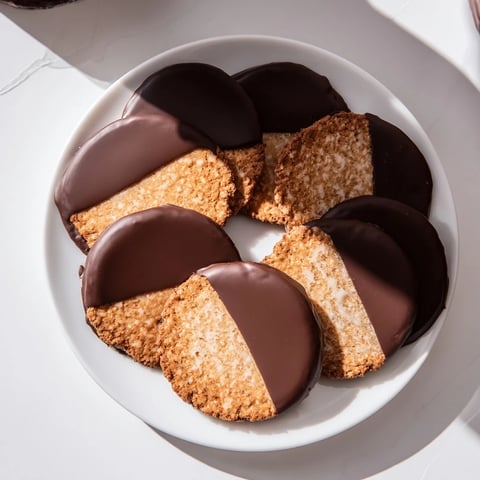 Warm, golden Simple Cookies: Vanilla Wafers dipped in glossy, semi-sweet melted chocolate for dessert.