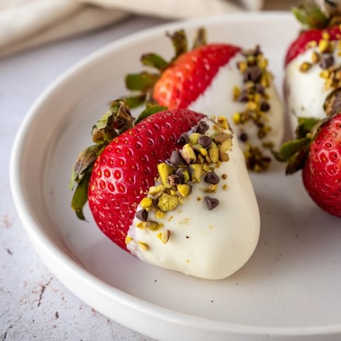 Fresh, creamy Yogurt Dipped Strawberry halves, a light and healthy, perfectly frozen dessert.