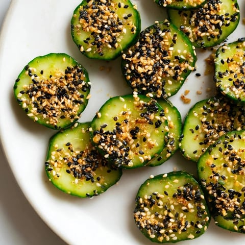 Refreshing Cucumber Shaker with Everything Bagel Seasoning: crisp cucumber slices lightly seasoned, ready to enjoy.