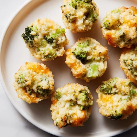 Golden-brown Cheesy Broccoli Casserole Bites, perfect for sharing as a party appetizer, or a snack.