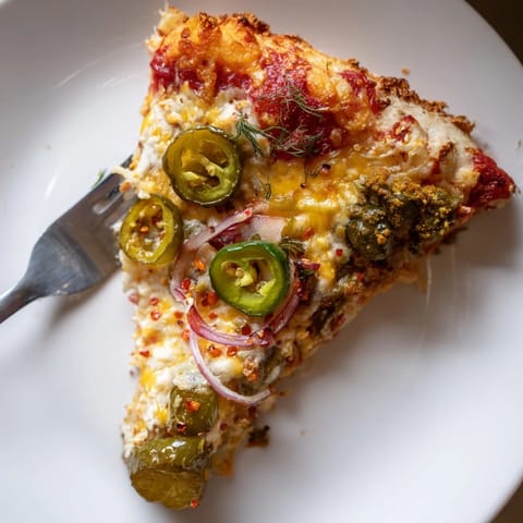 Delicious Cheesy Jalapeño Pickle Pizza Pie with crispy crust, spicy jalapeños, and tangy pickles.  