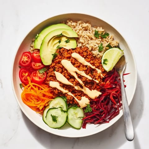 Satisfying plant-based meat bowl drizzled with spicy vegan mayo and lime.  