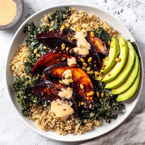 Imagine warm roasted beets over bed of quinoa with fresh kale and tahini in this beautiful Quinoa, Kale Bowl.
