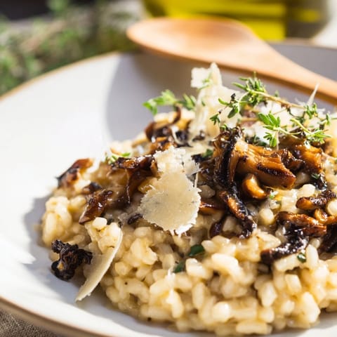 Golden roasted mushrooms and arborio rice blend in this rich, vegetarian Italian risotto main dish.