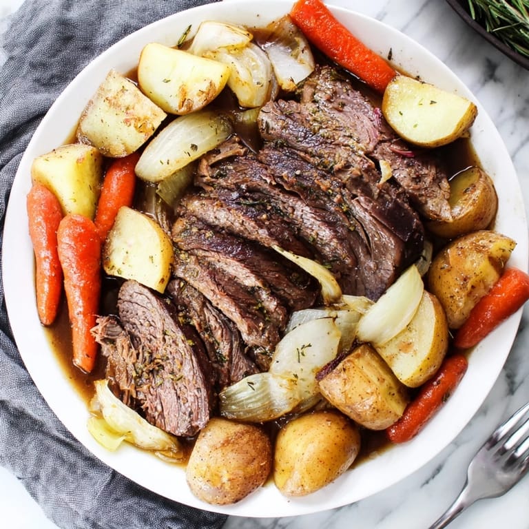Savory Sunday pot roast slowly cooked with carrots and potatoes, bursting with flavor.
