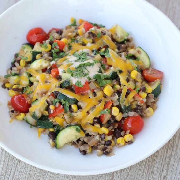 A flavorful Veggie-Packed Taco Skillet, offering a symphony of textures, from soft beans to fresh avocado yogurt.