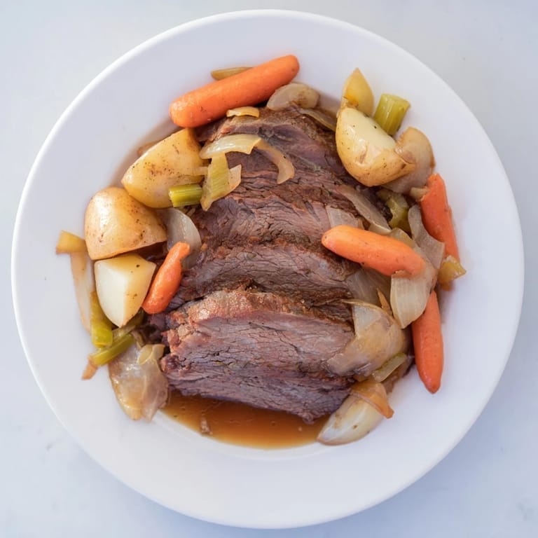 Close-up of a flavorful Pickle Brine Pot Roast, showcasing the fall-apart meat and hearty vegetables.