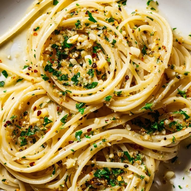 Close-up of golden Garlic Butter Linguine, a simple yet elegant vegetarian pasta dish.
